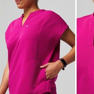 Fabletics Vibrant Magenta scrub top and bottom.